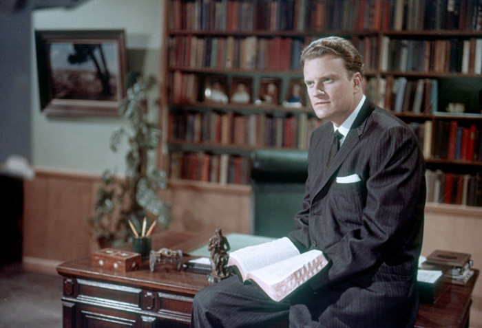 Billy Graham with book